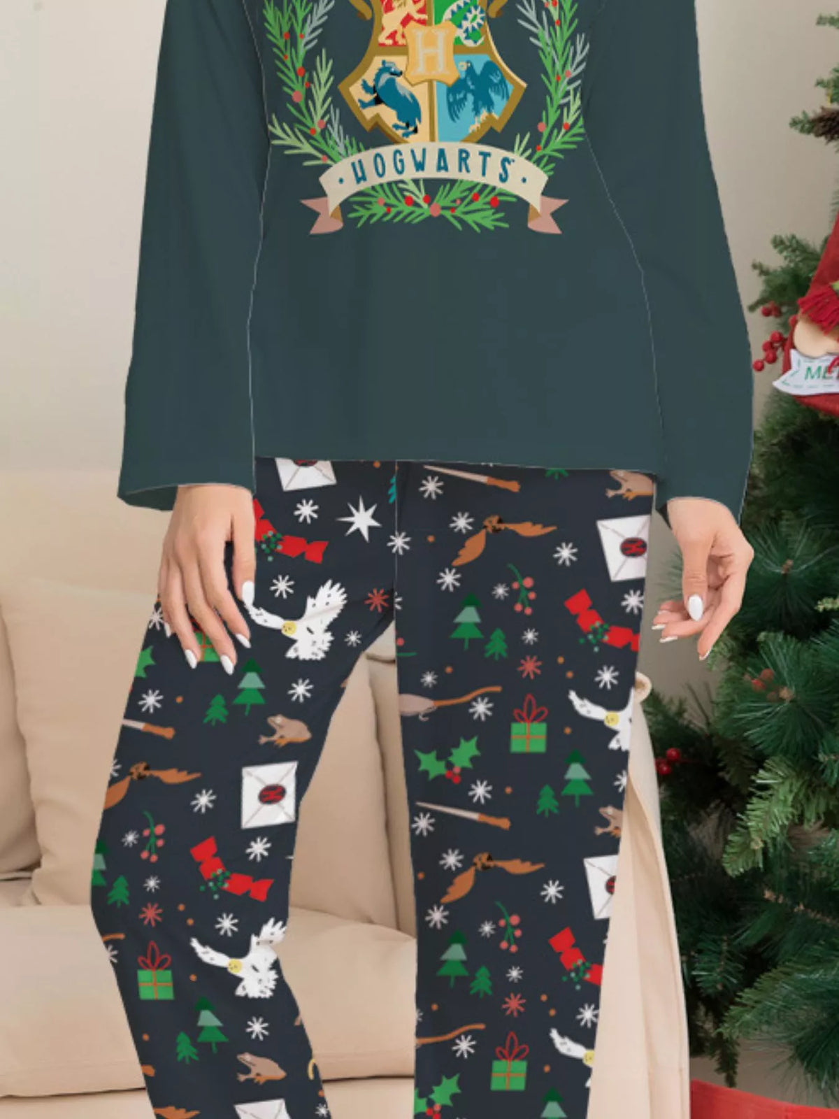 Hogwarts crest graphic on the dark green pajama top