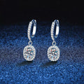 Silver-tone hoop earrings with oval halo stone drops