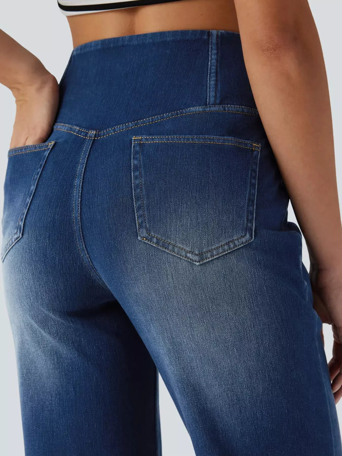 Dark blue high-waisted crossover waistband straight-leg jeans — back view