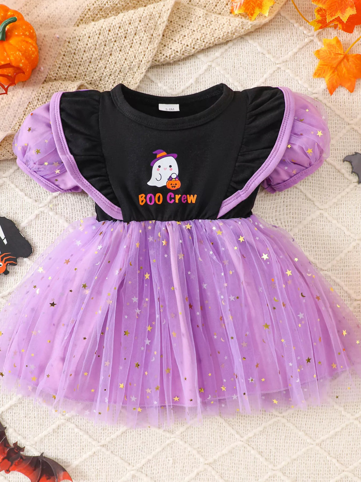 Flat lay of the black and purple Boo Crew Halloween tulle dress.
