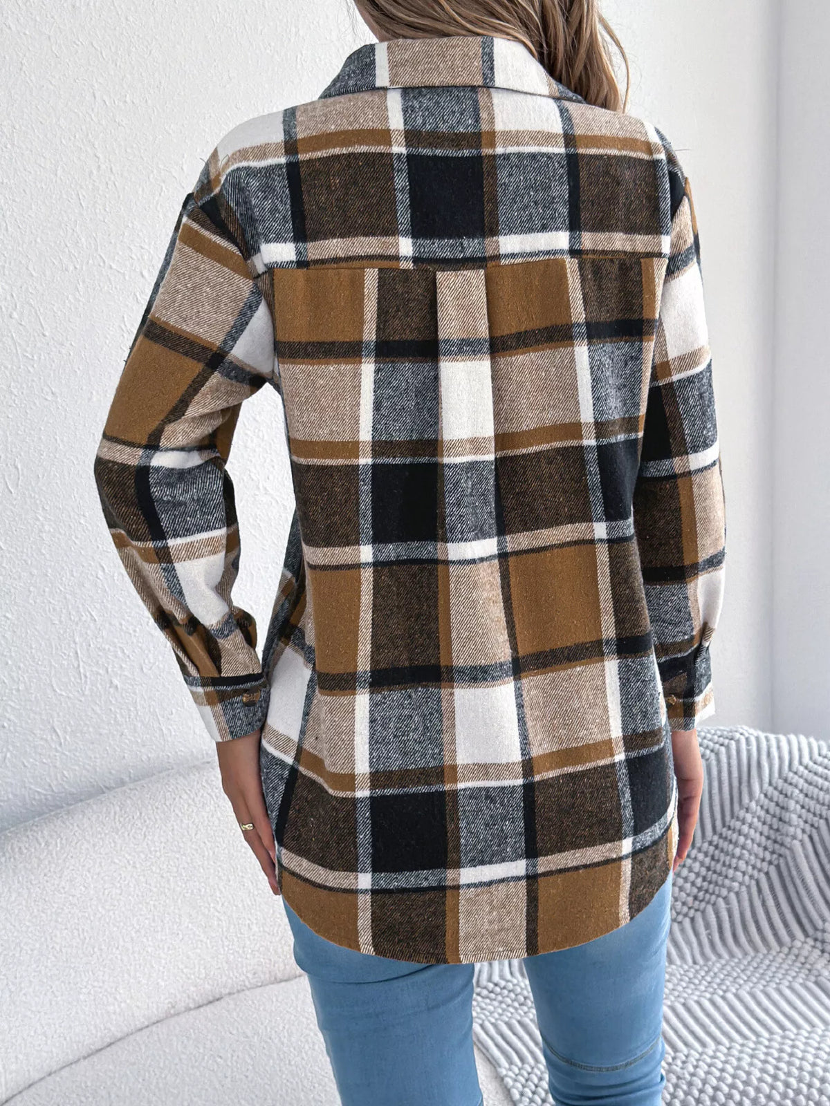 Khaki plaid button-down shacket with chest pockets, back view.