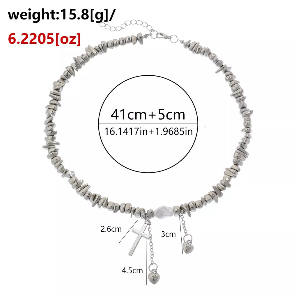 Measurements diagram for chunky silver-tone chain necklace with cross and dangling charms