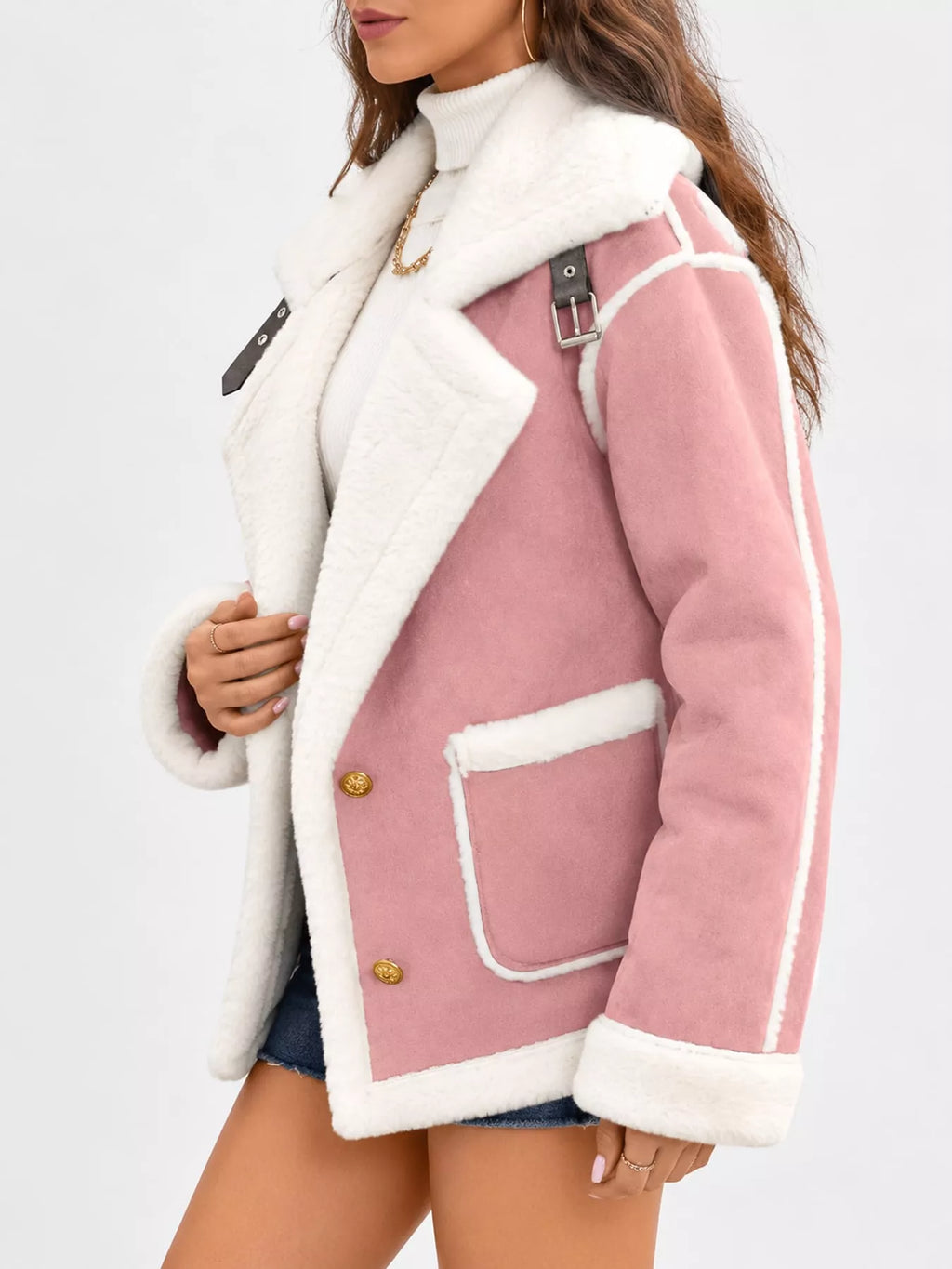 Pink jacket with wide white plush lapels, contrast trim and front pockets, side view.