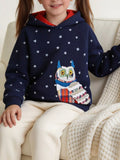 Seated child wearing a navy star-print hoodie with a colorful owl applique.