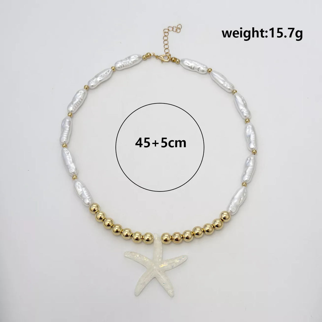 Measurements diagram for starfish pendant necklace with gold-tone beads and white shell-like links