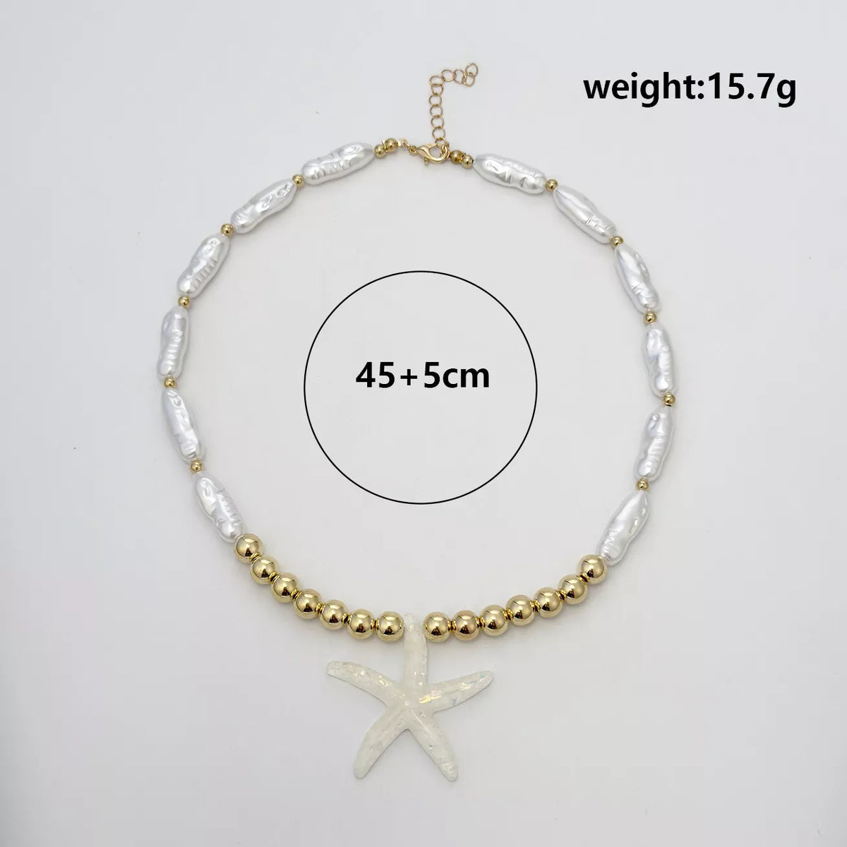 Measurements diagram for starfish pendant necklace with gold-tone beads and white shell-like links