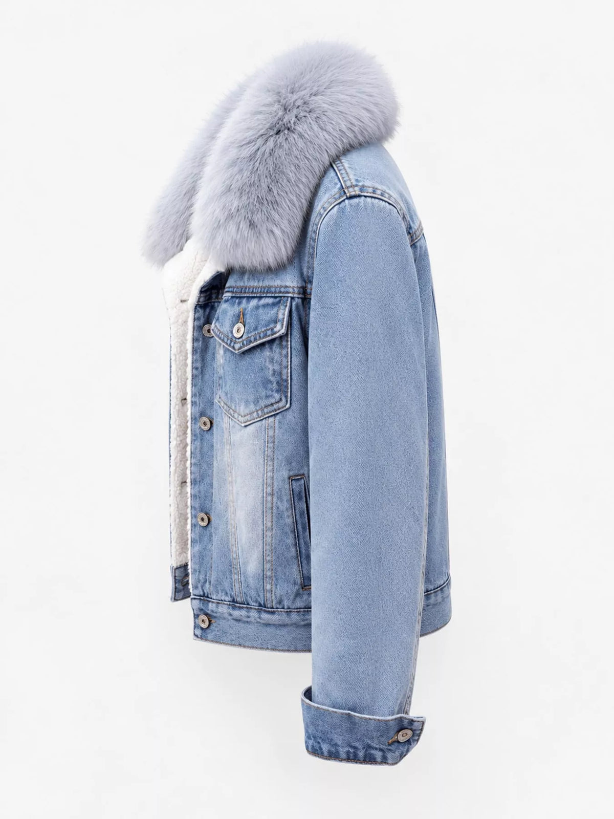 Side view of the light-blue denim jacket with gray plush collar.