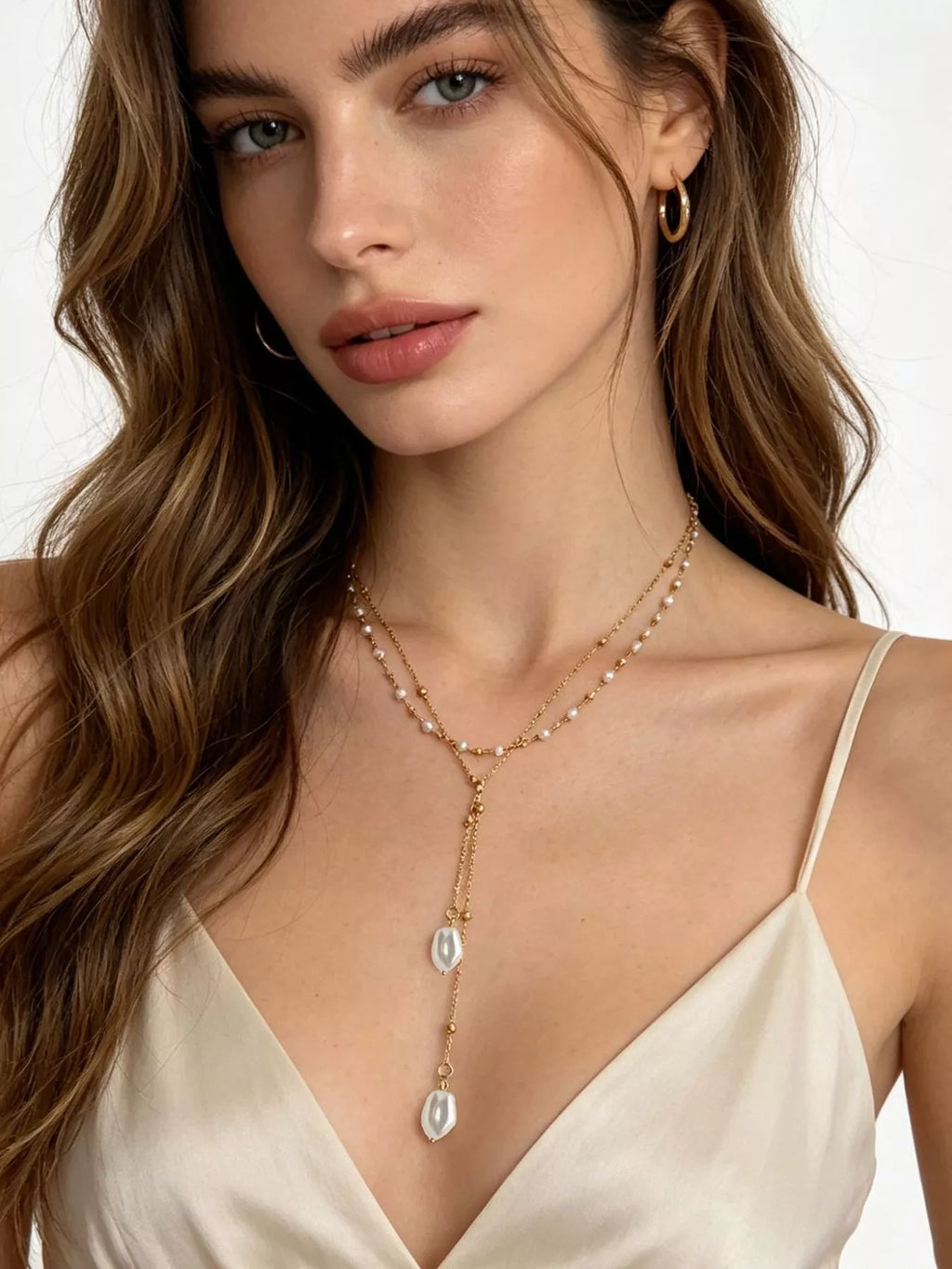 Gold-tone layered Y-shaped necklace with pearl-like pendants