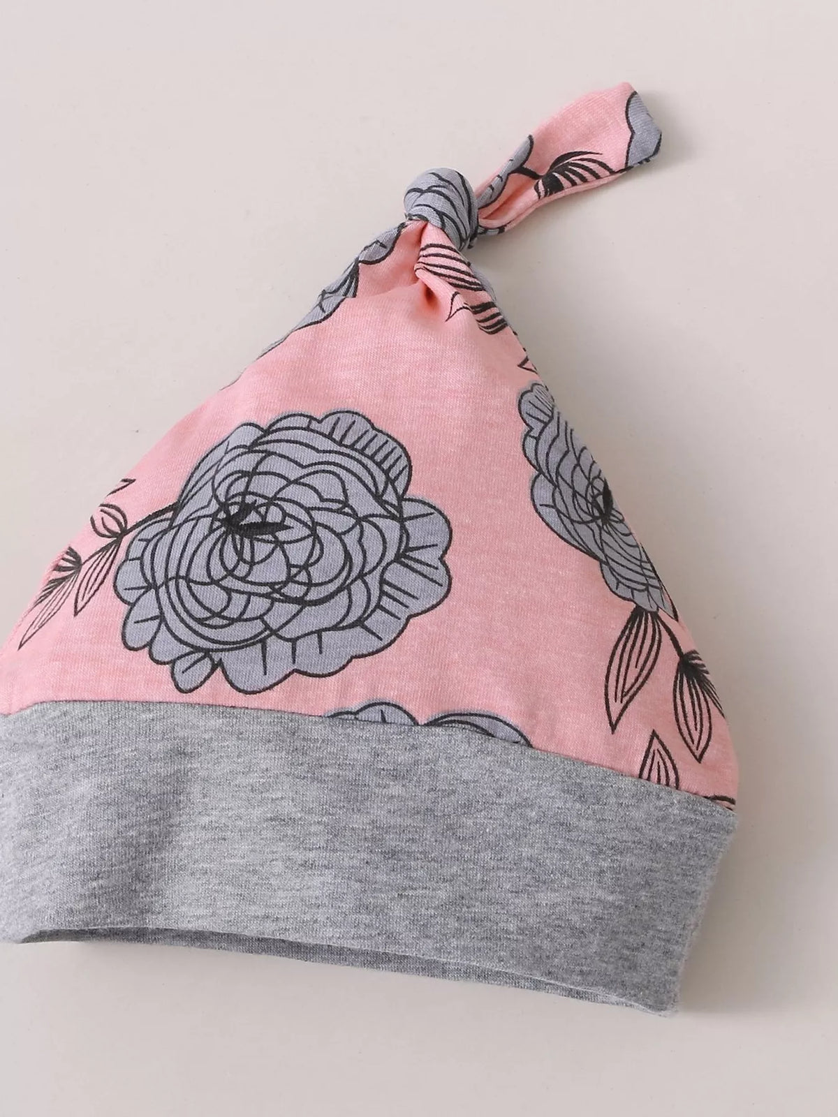 Pink floral baby hat with a gray cuff