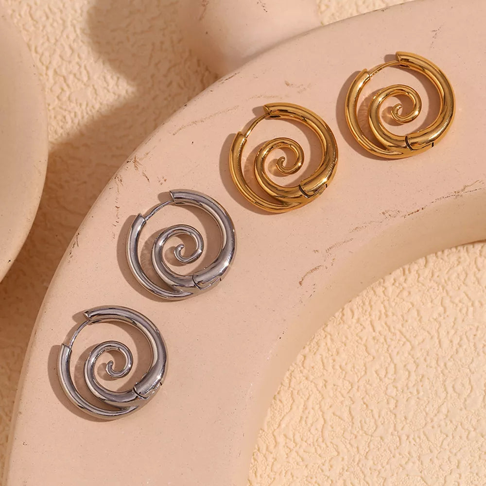 Spiral hoop earrings in gold-tone and silver-tone finishes — detail view