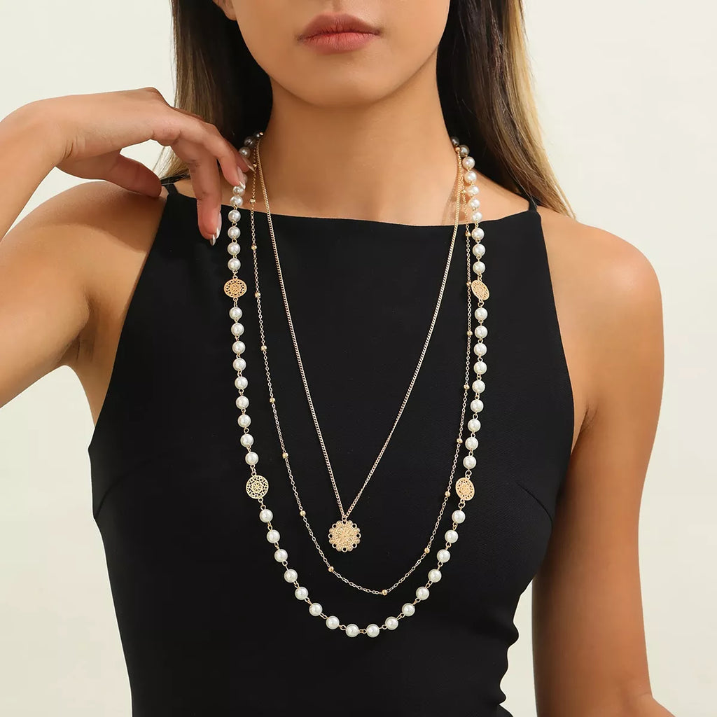 Layered pearl-like bead and coin pendant necklace