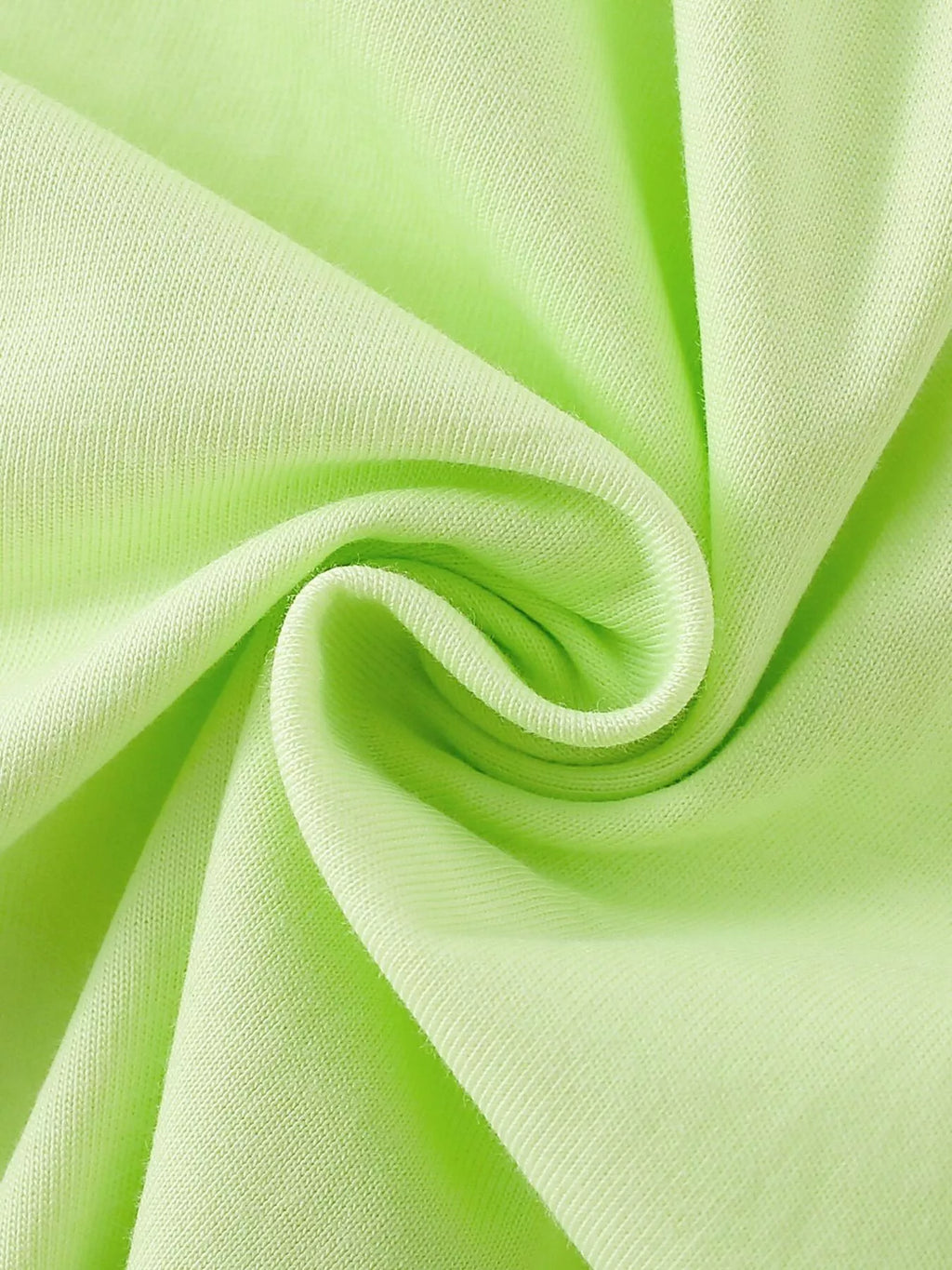 Close view of the light green top's fabric texture.