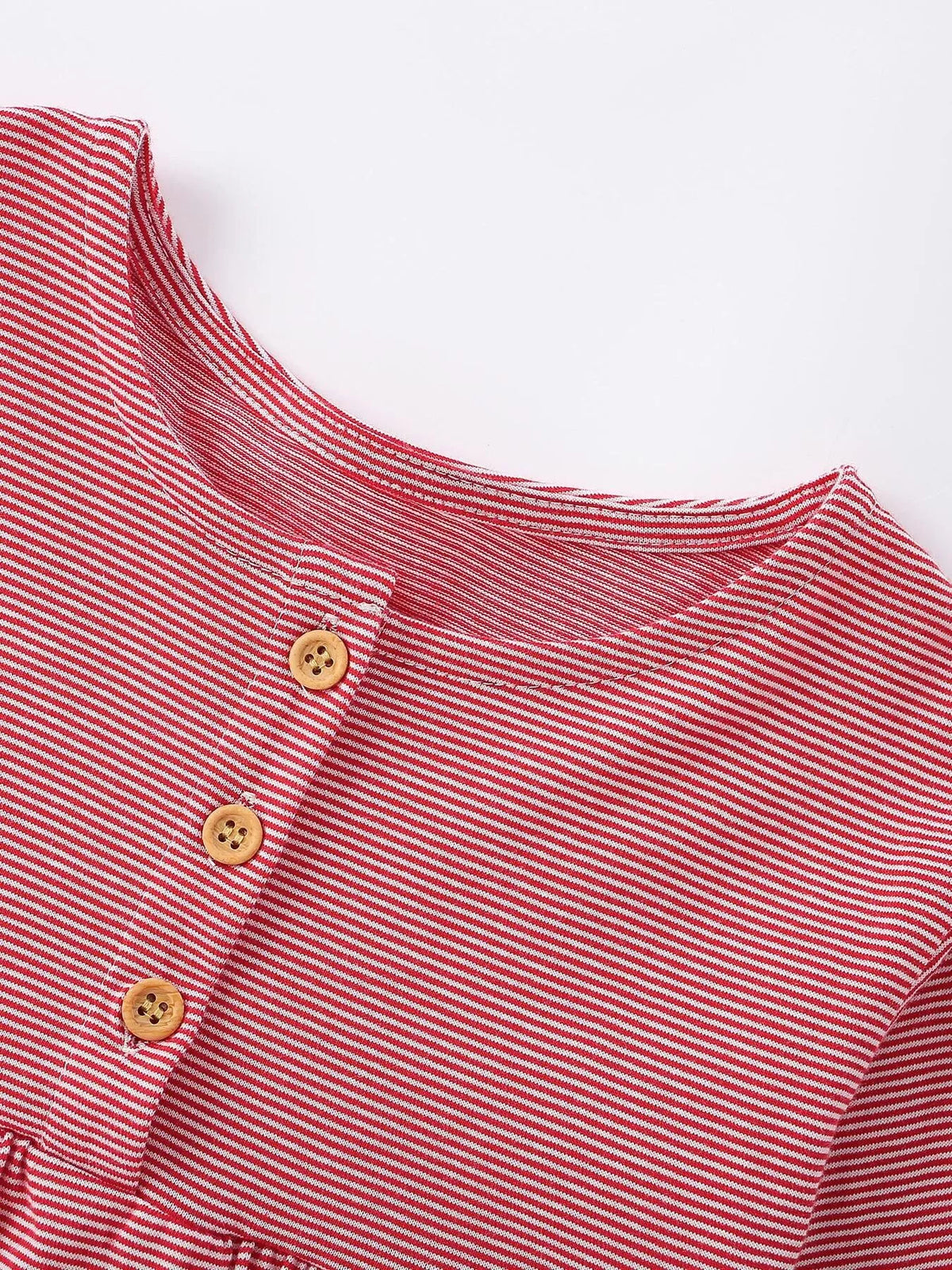Close-up of the red striped dress neckline and three-button placket.