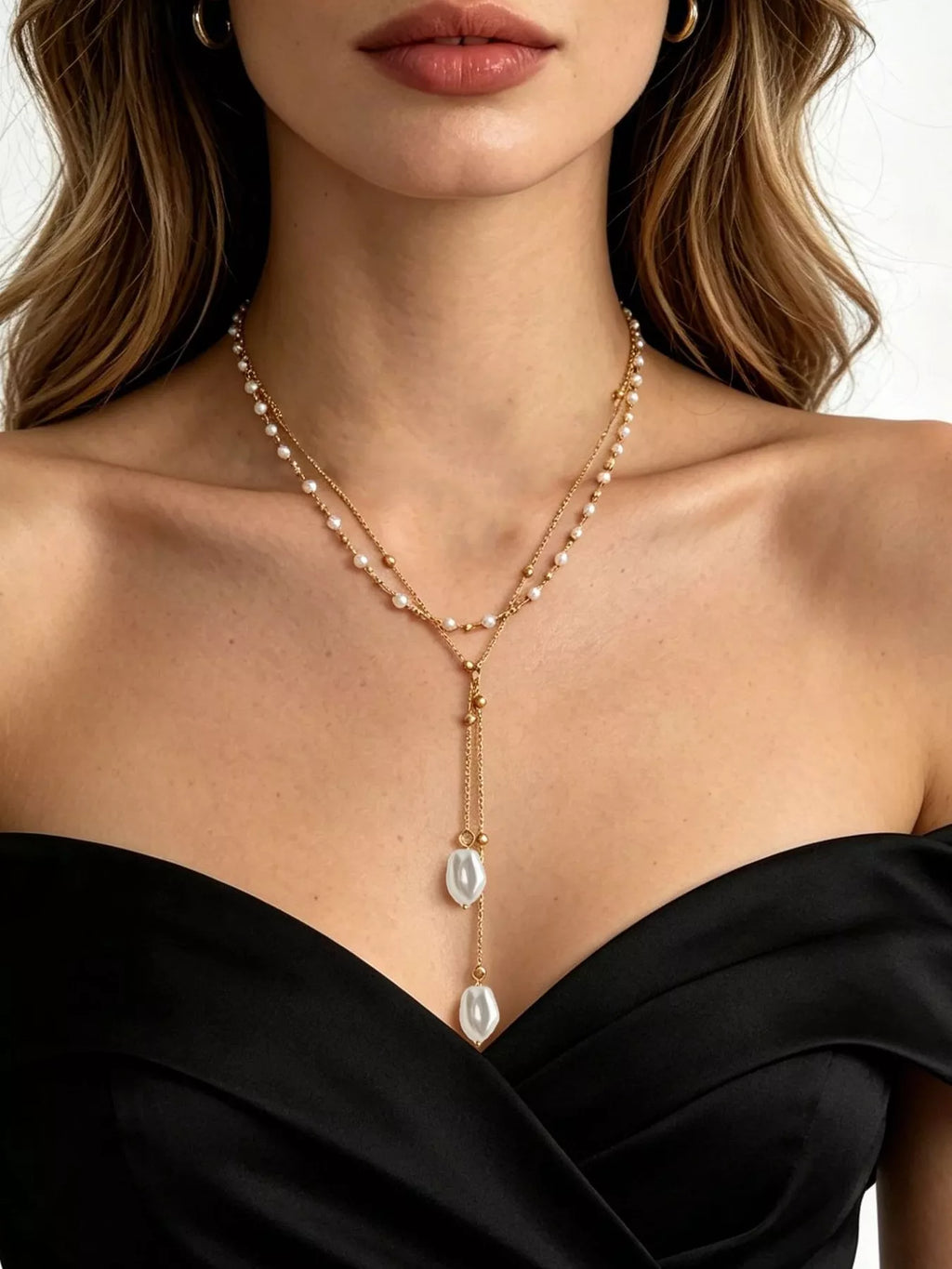 Gold-tone layered Y-shaped necklace with pearl-like pendants