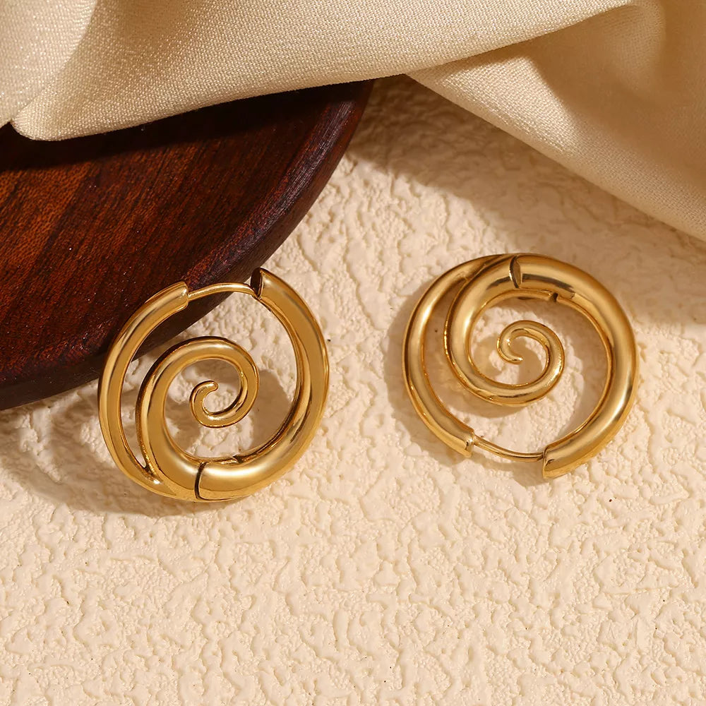 Gold-tone spiral hoop earrings — detail view