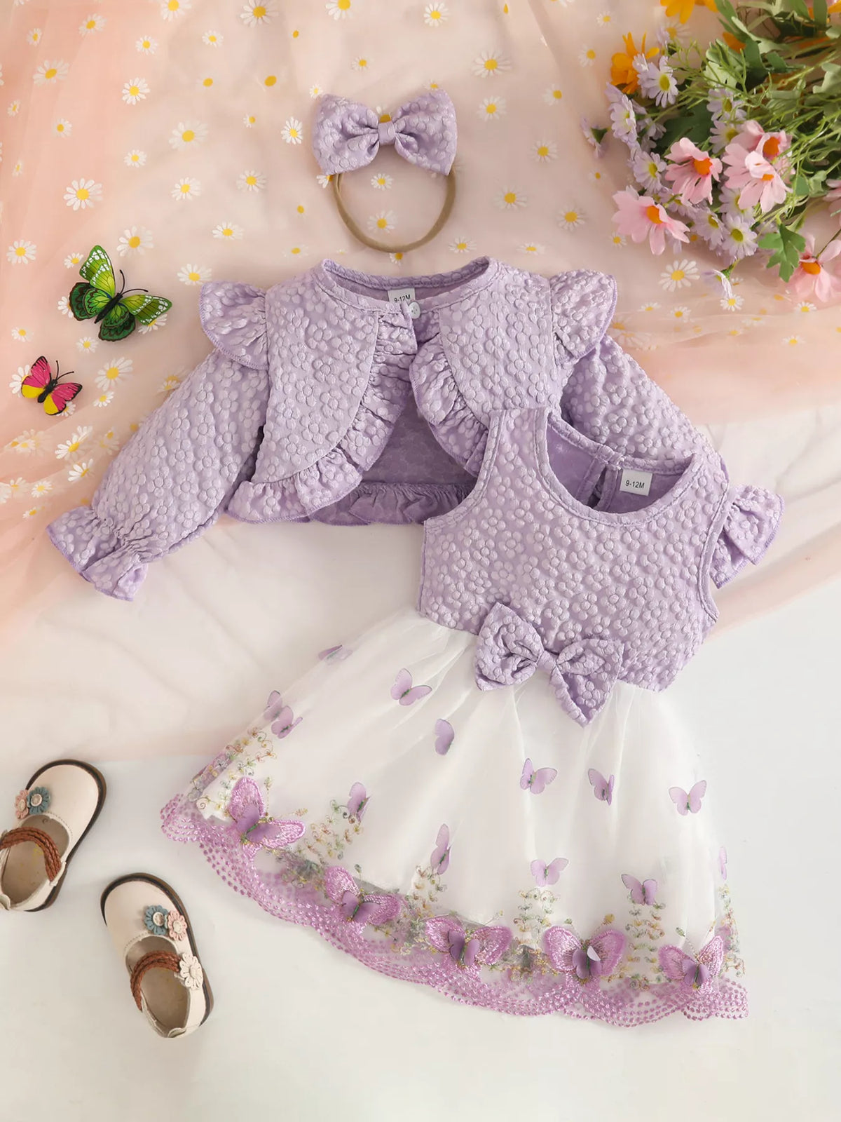 Lavender floral baby outfit with cropped jacket, vest, white tulle skirt and bow headband.