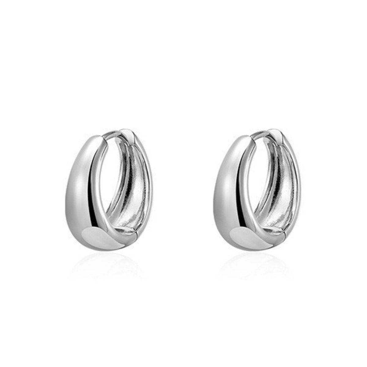 Rounded silver-tone hoop earrings — detail view