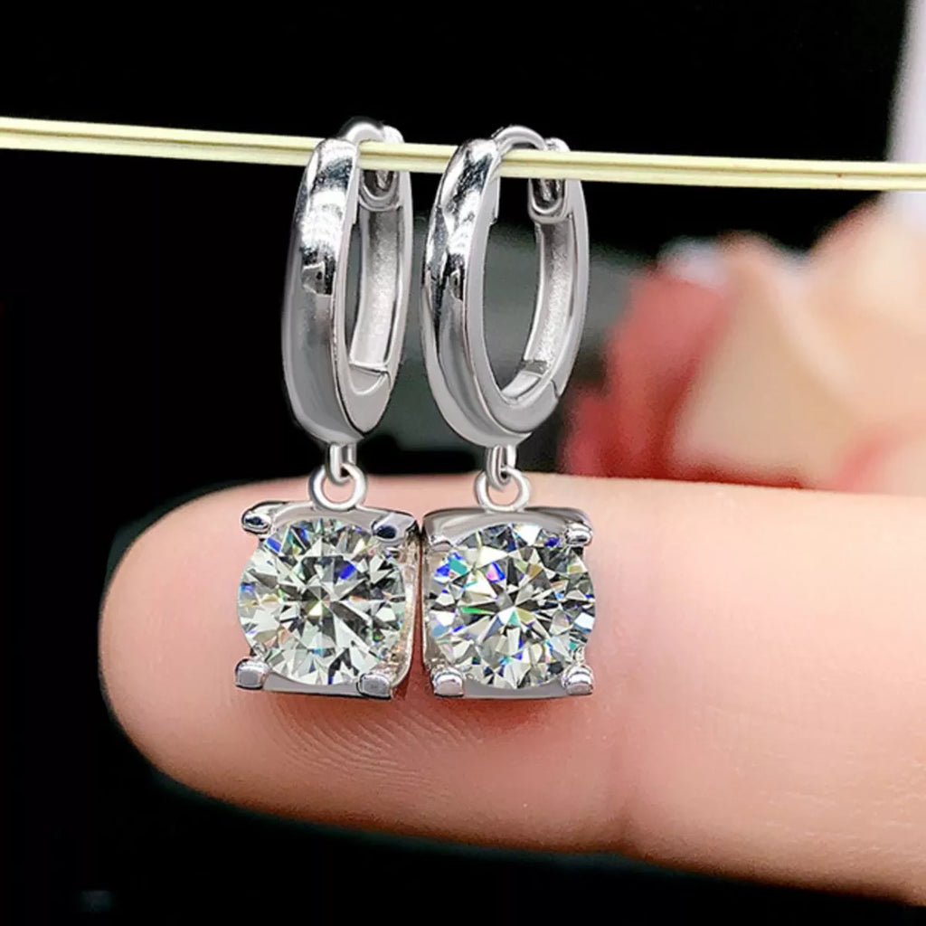 Silver-tone hoop earrings with square clear stone drops — detail view