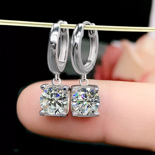 Silver-tone hoop earrings with square clear stone drops — detail view
