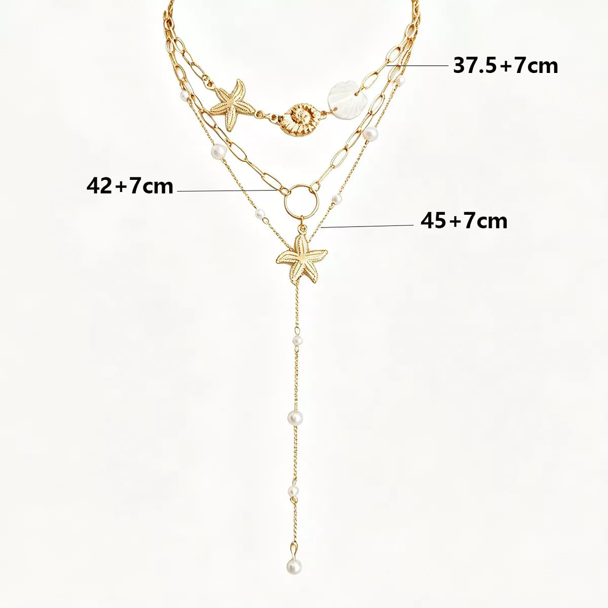 Measurements diagram for layered gold-tone necklaces with starfish and shell charms