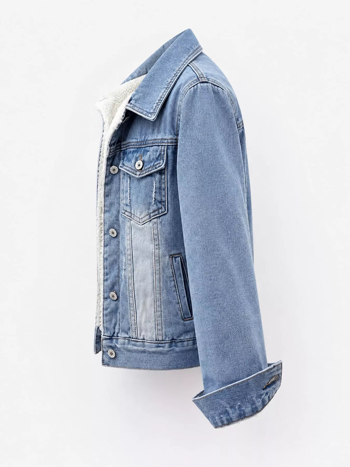 Side view of the light-wash fleece-lined denim jacket.