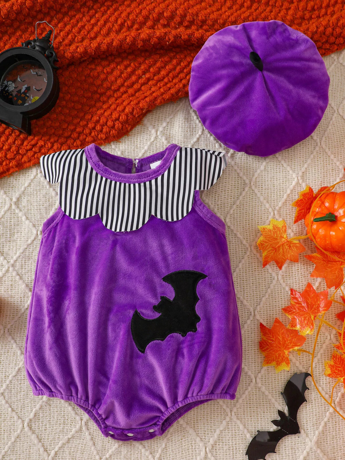 Purple bat-applique baby bodysuit with striped yoke and matching purple hat