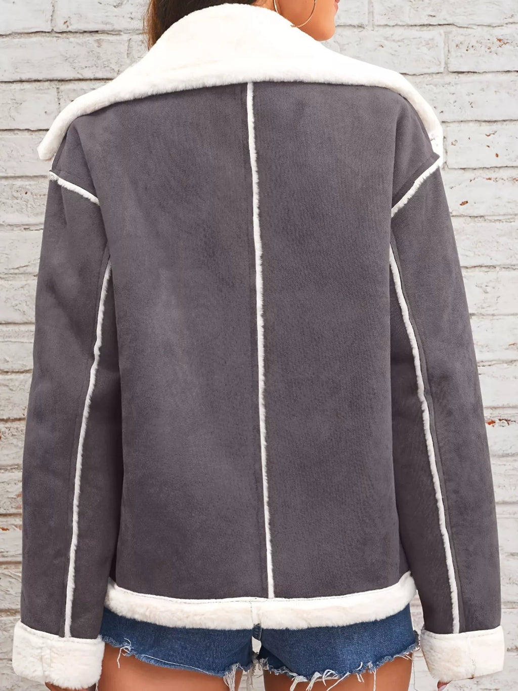 Dark-gray jacket with wide white plush lapels, contrast trim and front pockets, back view.