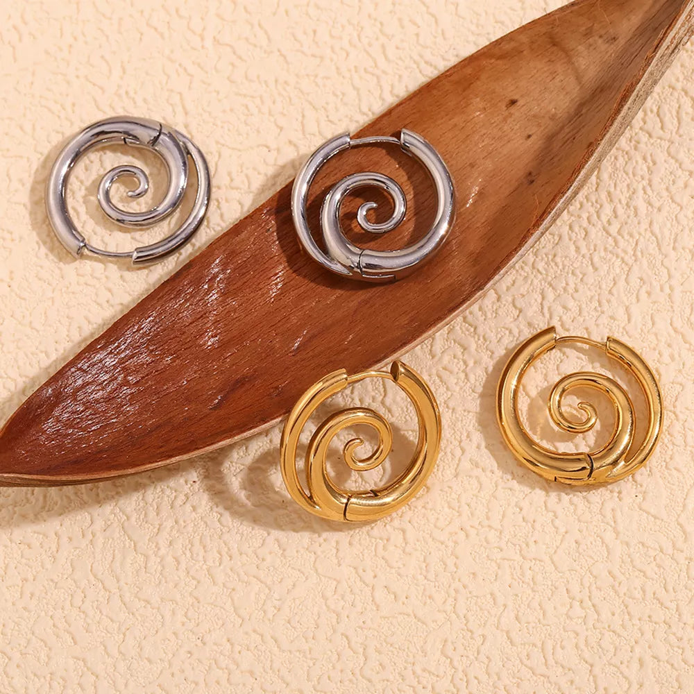 Spiral hoop earrings in gold-tone and silver-tone finishes — detail view