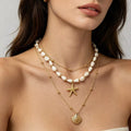 Layered gold-tone shell and starfish charm necklace