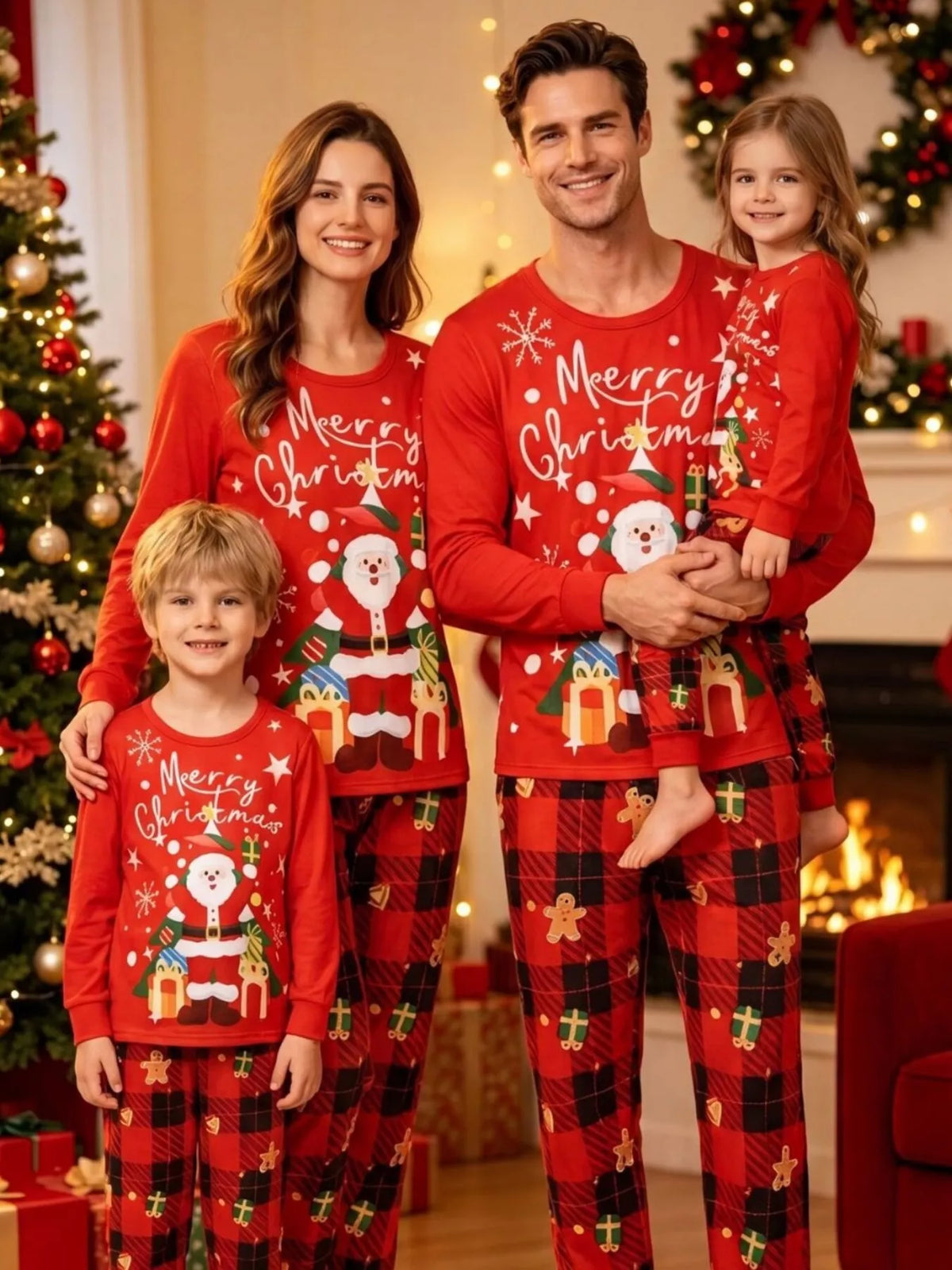 Family posing in red Merry Christmas matching pajamas with festive graphics.