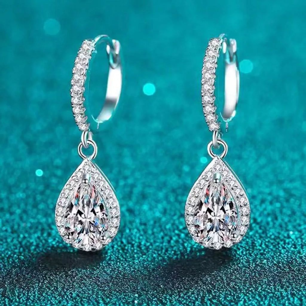 Silver-tone hoop earrings with teardrop halo stone drops