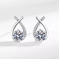 Silver-tone open teardrop earrings with round clear stones — detail view