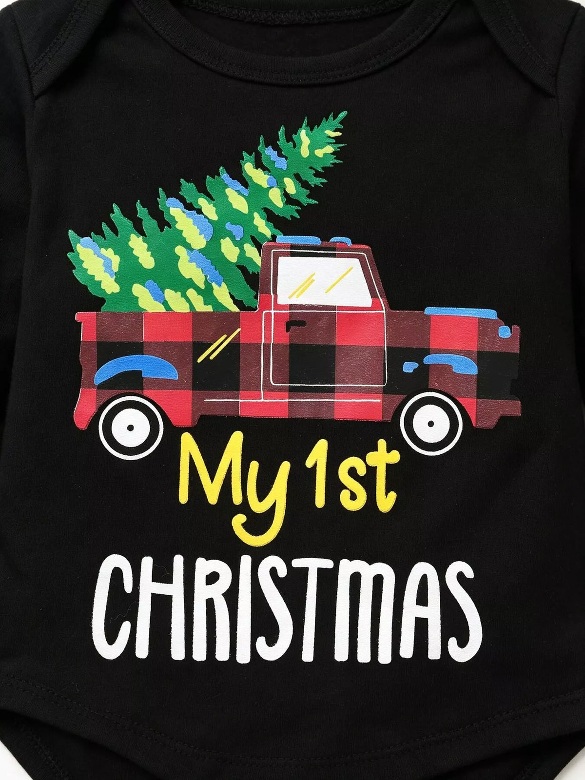 Close-up of the plaid truck, Christmas tree and My 1st Christmas graphic on a black top.