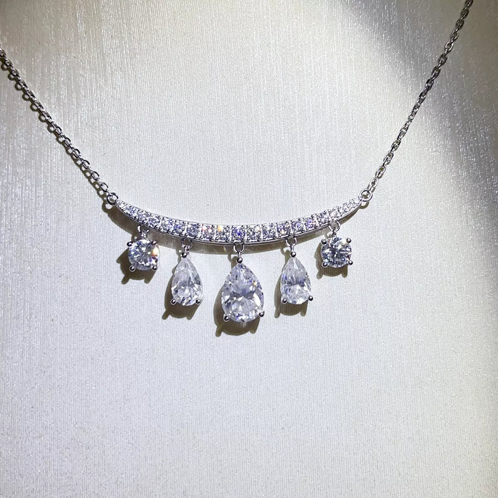 Silver-tone necklace with graduated teardrop stone pendants