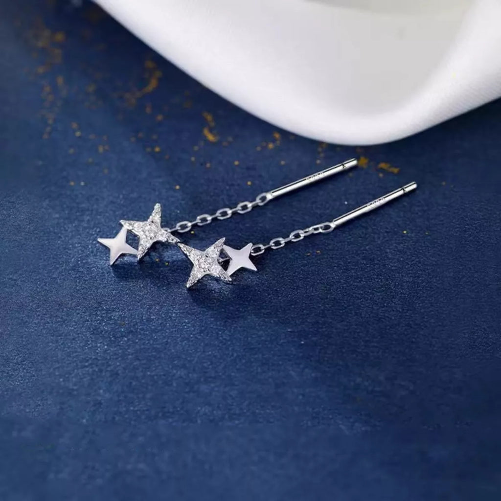 Silver-tone star earrings with long chain drops