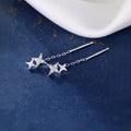 Silver-tone star earrings with long chain drops