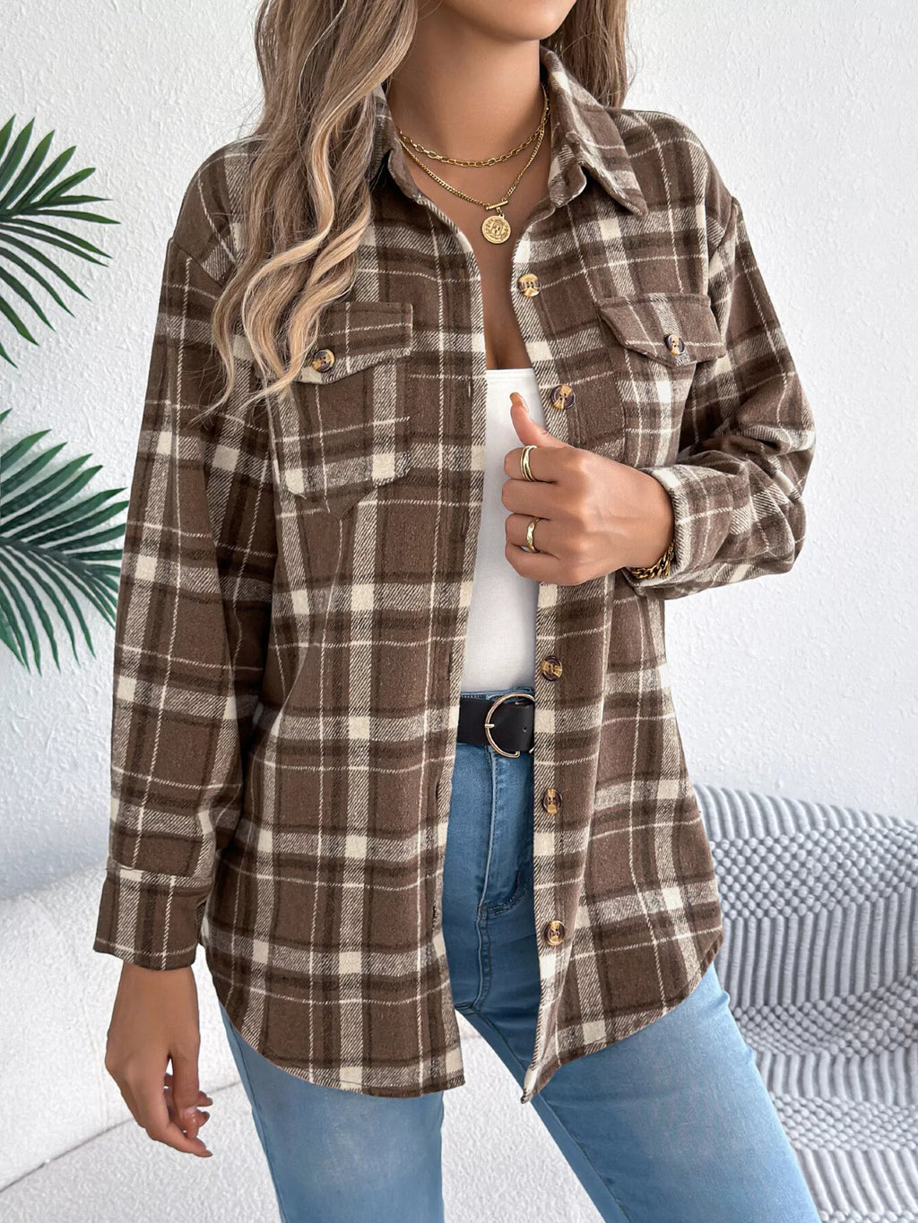 Brown plaid button-down shacket with chest pockets, front view.