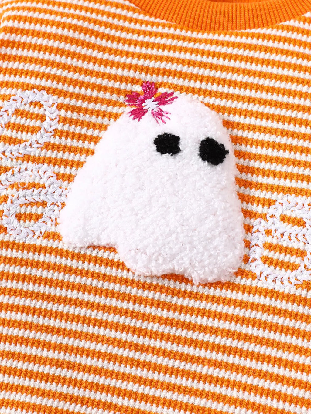White ghost with a pink bow on the orange-striped pajama top