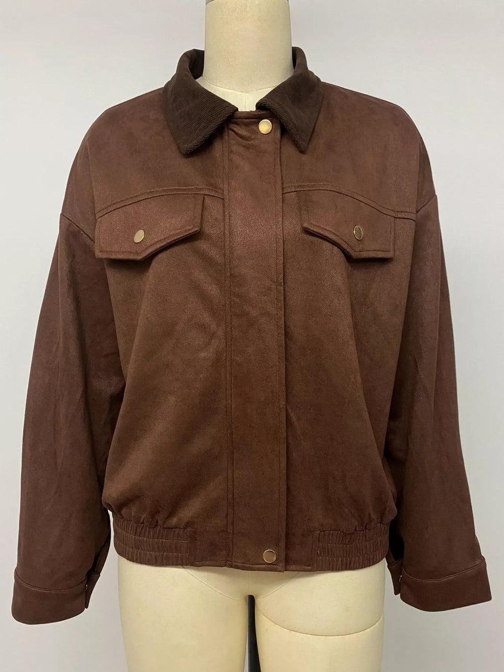 Brown contrast-collar jacket shown from the front on a mannequin.