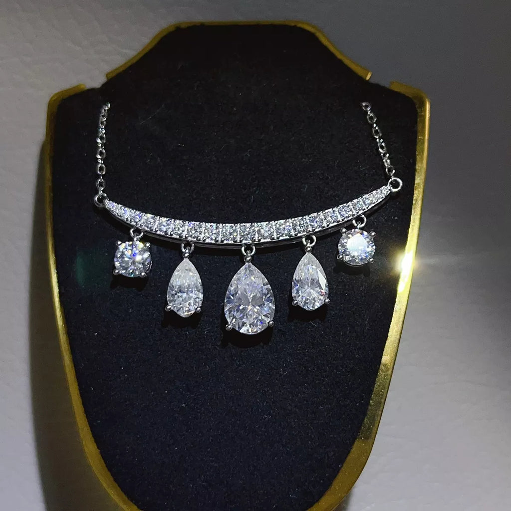 Silver-tone necklace with graduated teardrop stone pendants