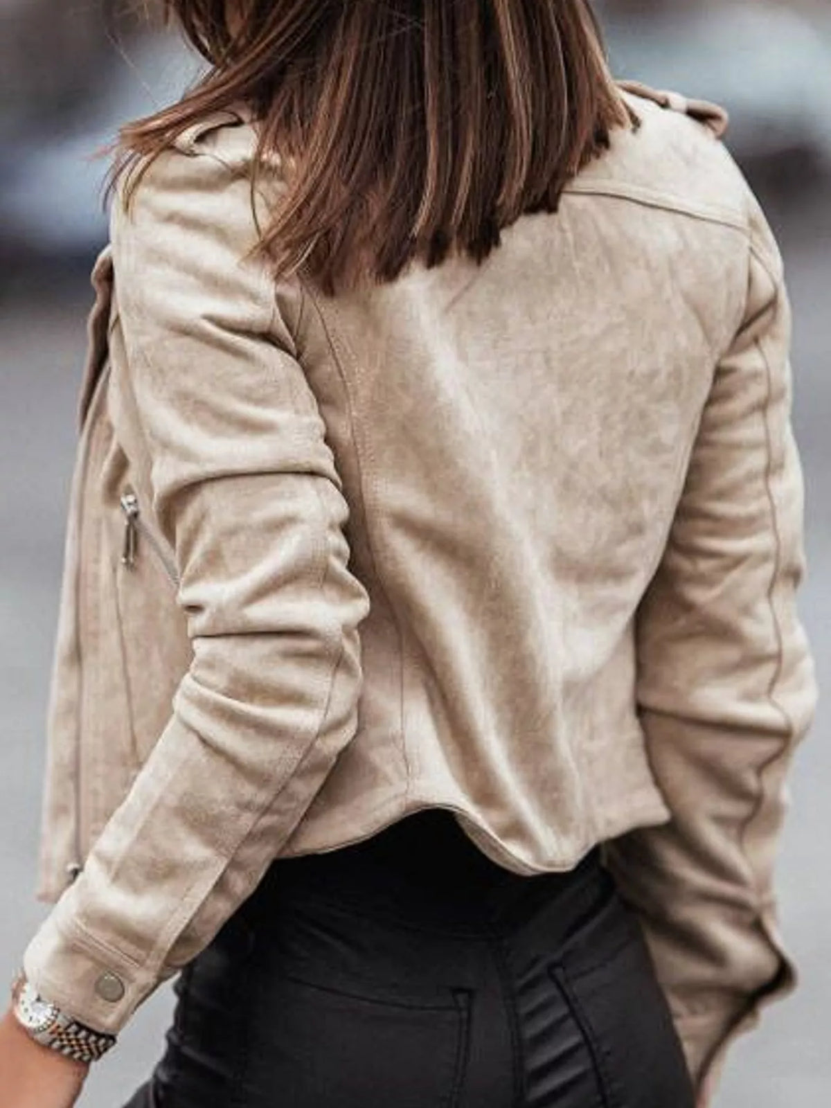 Back view of the apricot moto-style jacket.