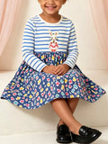 Blue and white striped bunny graphic dress with a dark floral skirt worn by a child