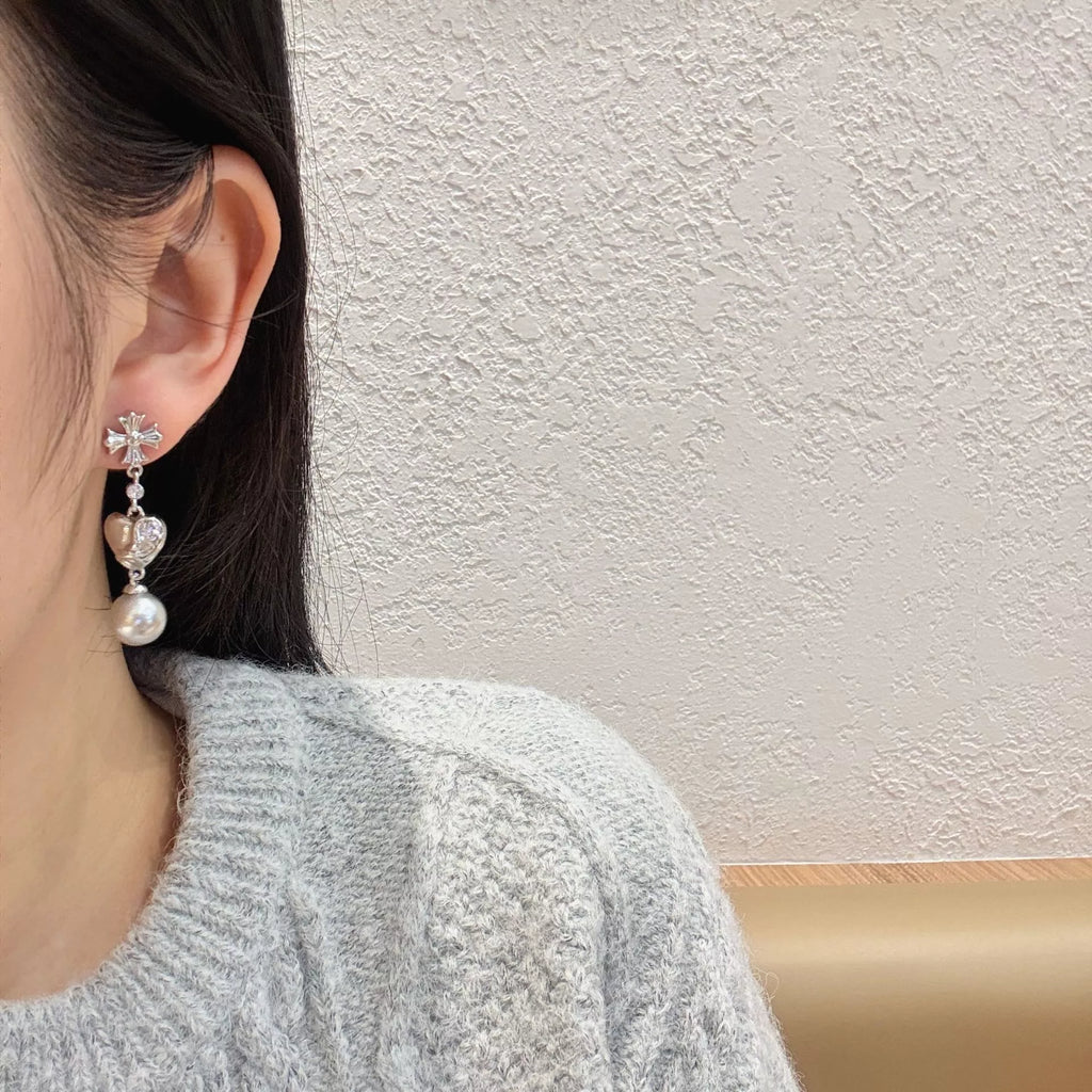 Heart-shaped drop earrings with gray pearl-like beads