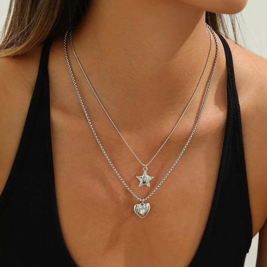 Layered silver-tone star and heart pendant necklaces