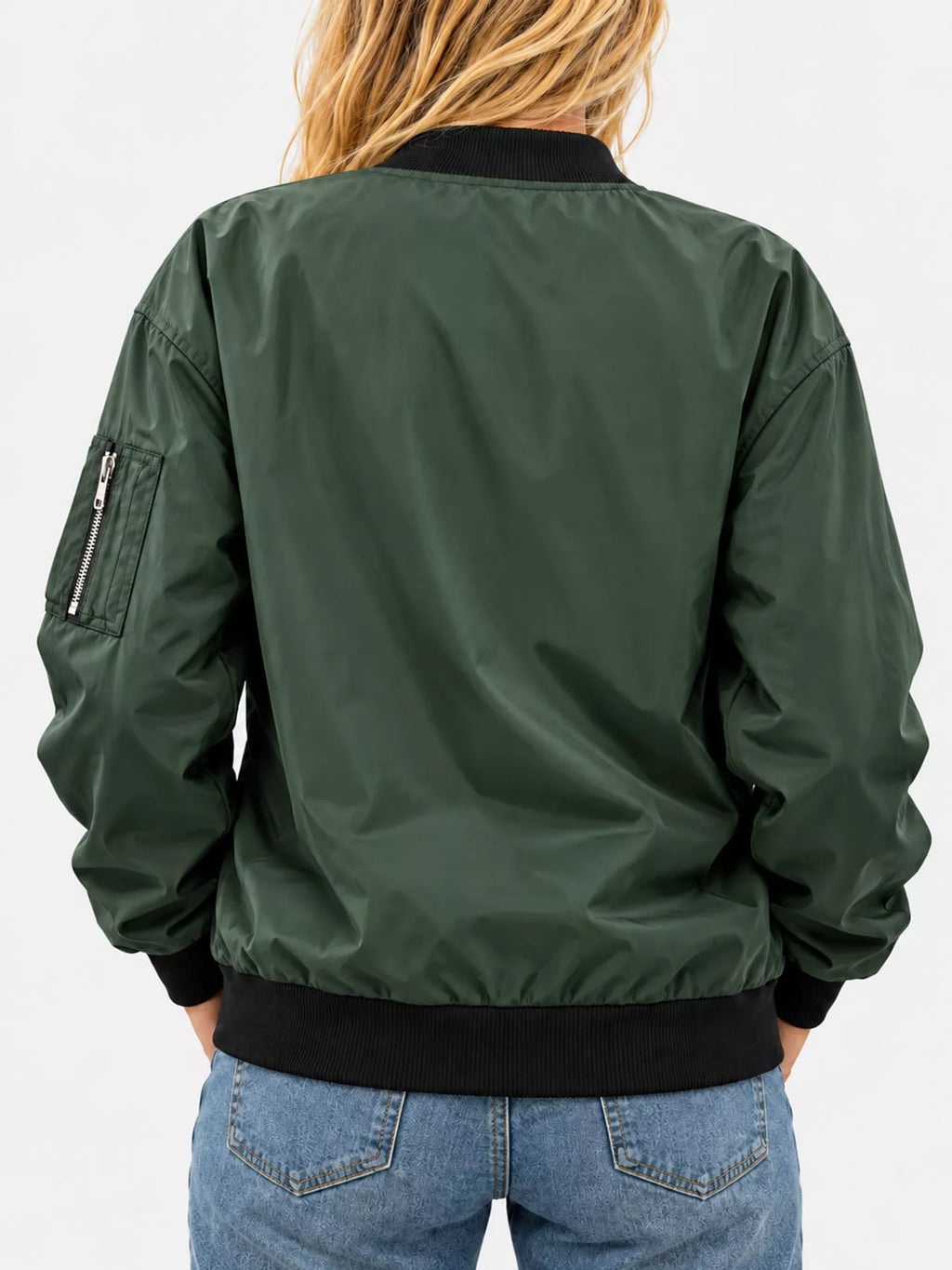 Back view of the dark-green bomber jacket and ribbed hem.