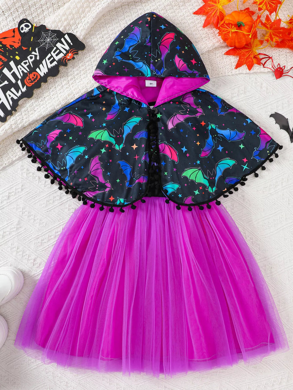 Black bat-print hooded cape paired with a black bodice and bright purple tulle skirt.