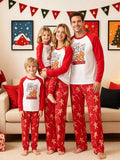 Family wearing matching white Oh Snap gingerbread graphic tops with red sleeves and red printed pajama pants.