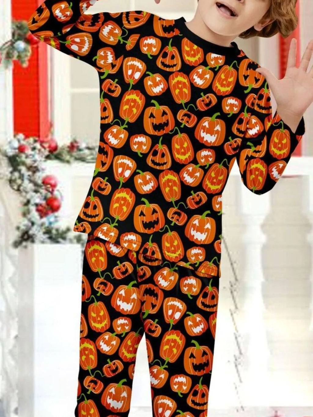 Close-up of the pumpkin-print children's pajama top.
