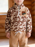 Tan camouflage quarter-zip top and tan joggers worn by a child
