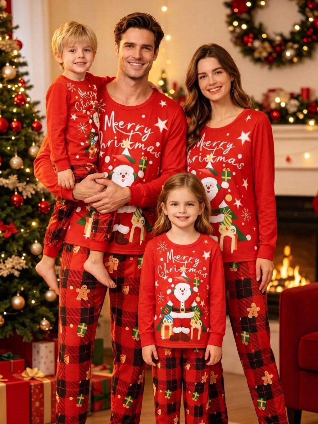 Adults and children wearing red Christmas graphic tops and plaid pants.